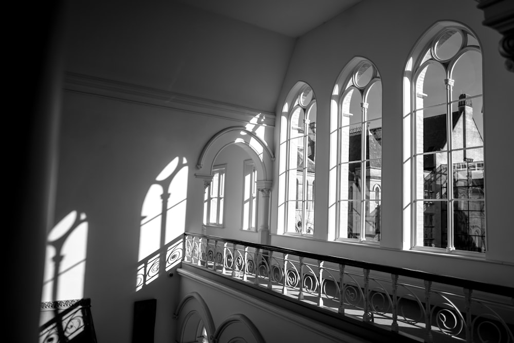 a black and white photo of windows in a building