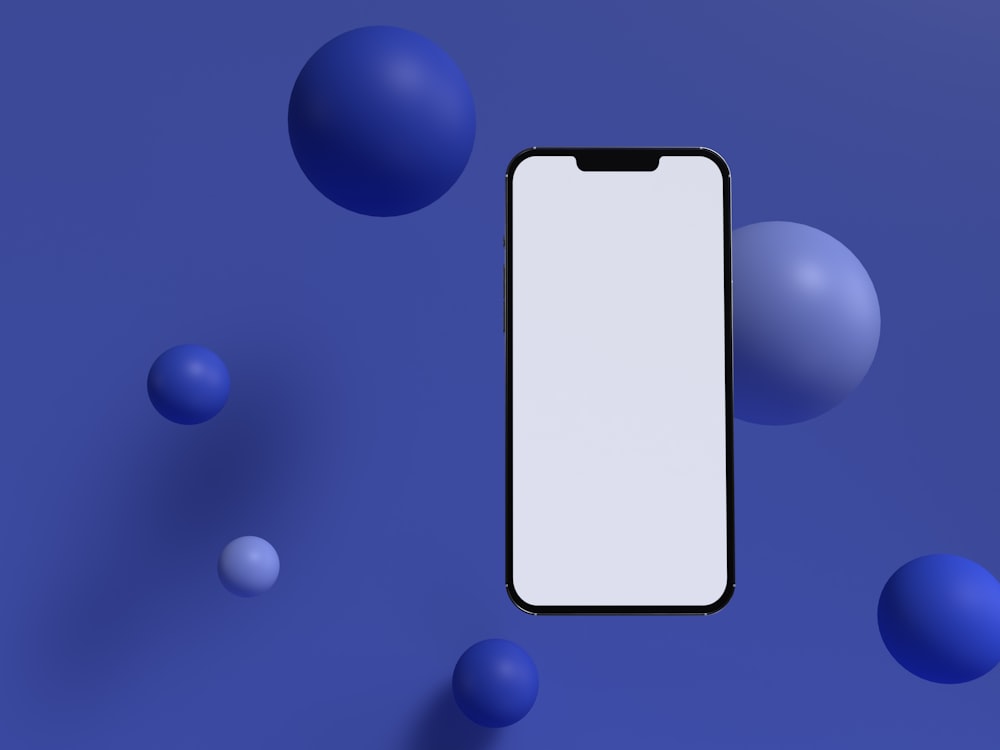 a cell phone sitting on top of a blue surface