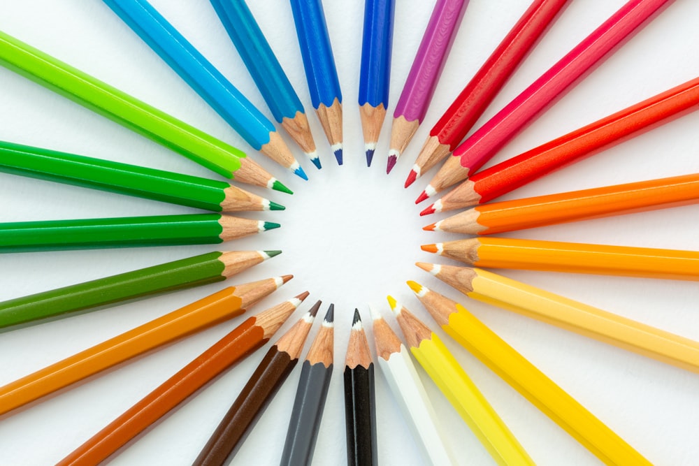 a circle of colored pencils arranged in a circle