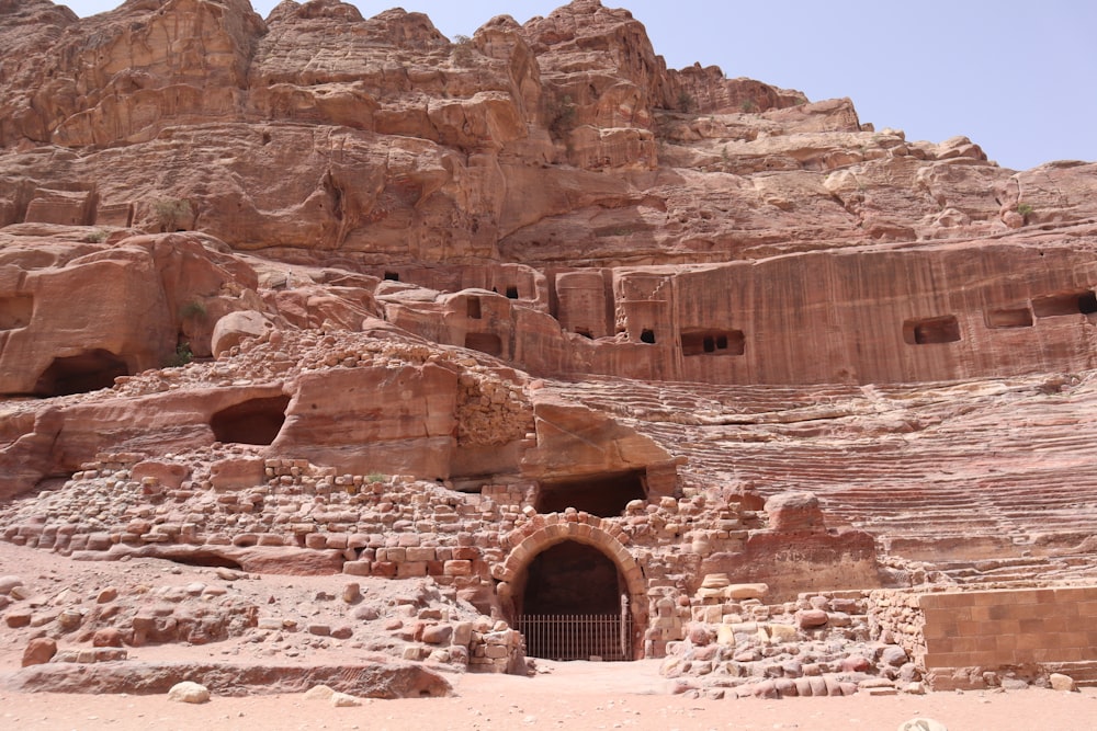 a large rock formation with a cave in the middle of it