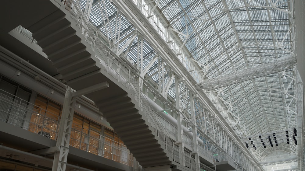 the ceiling of a large building with a lot of windows