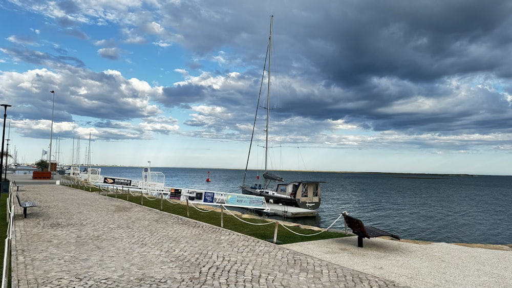 a boat is docked at the end of the pier