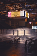 a room filled with tables covered in smoke