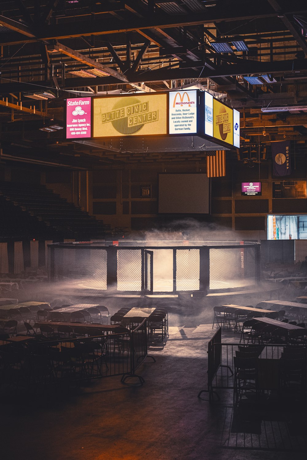 a room filled with tables covered in smoke