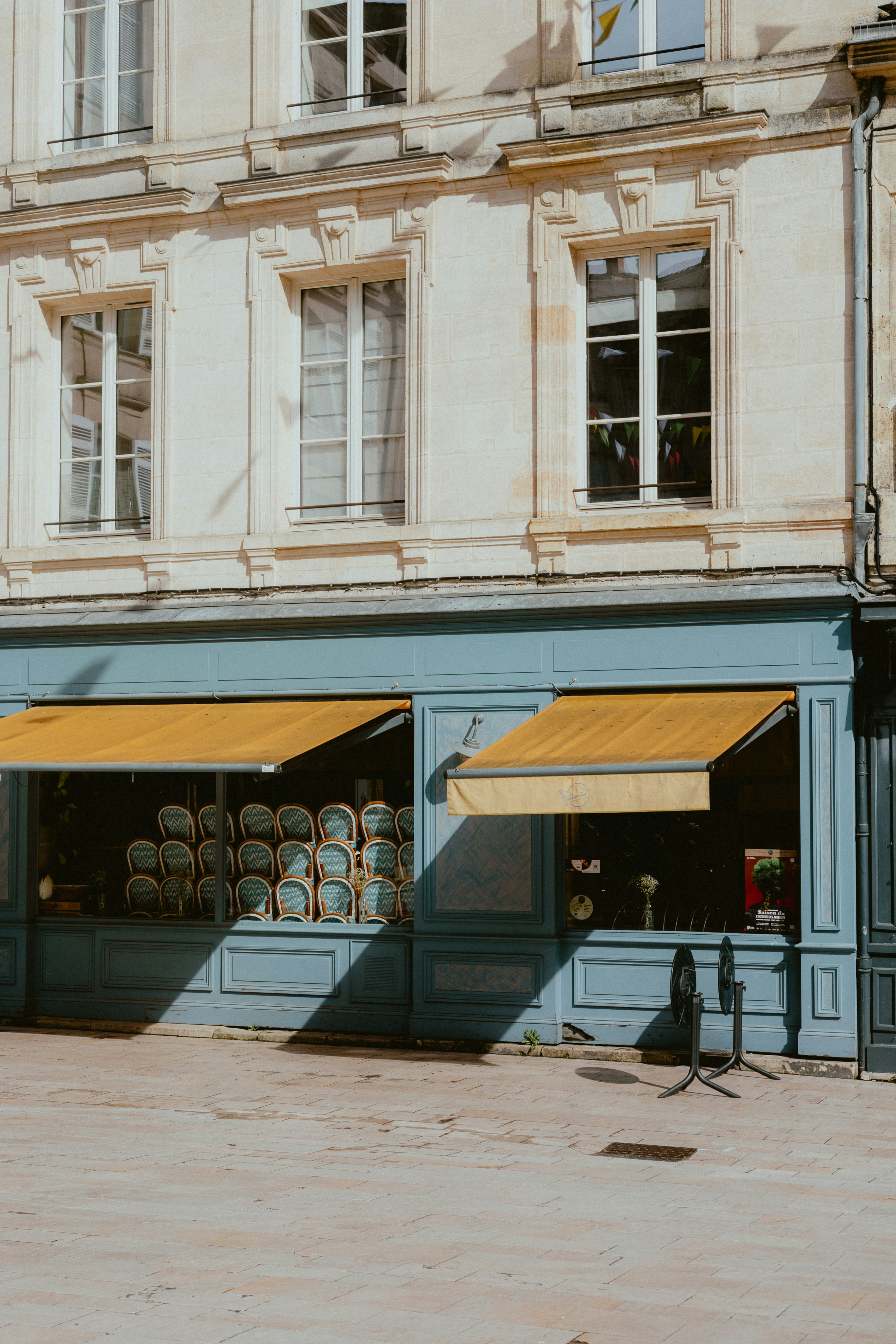 a building with a yellow awning on the front of it