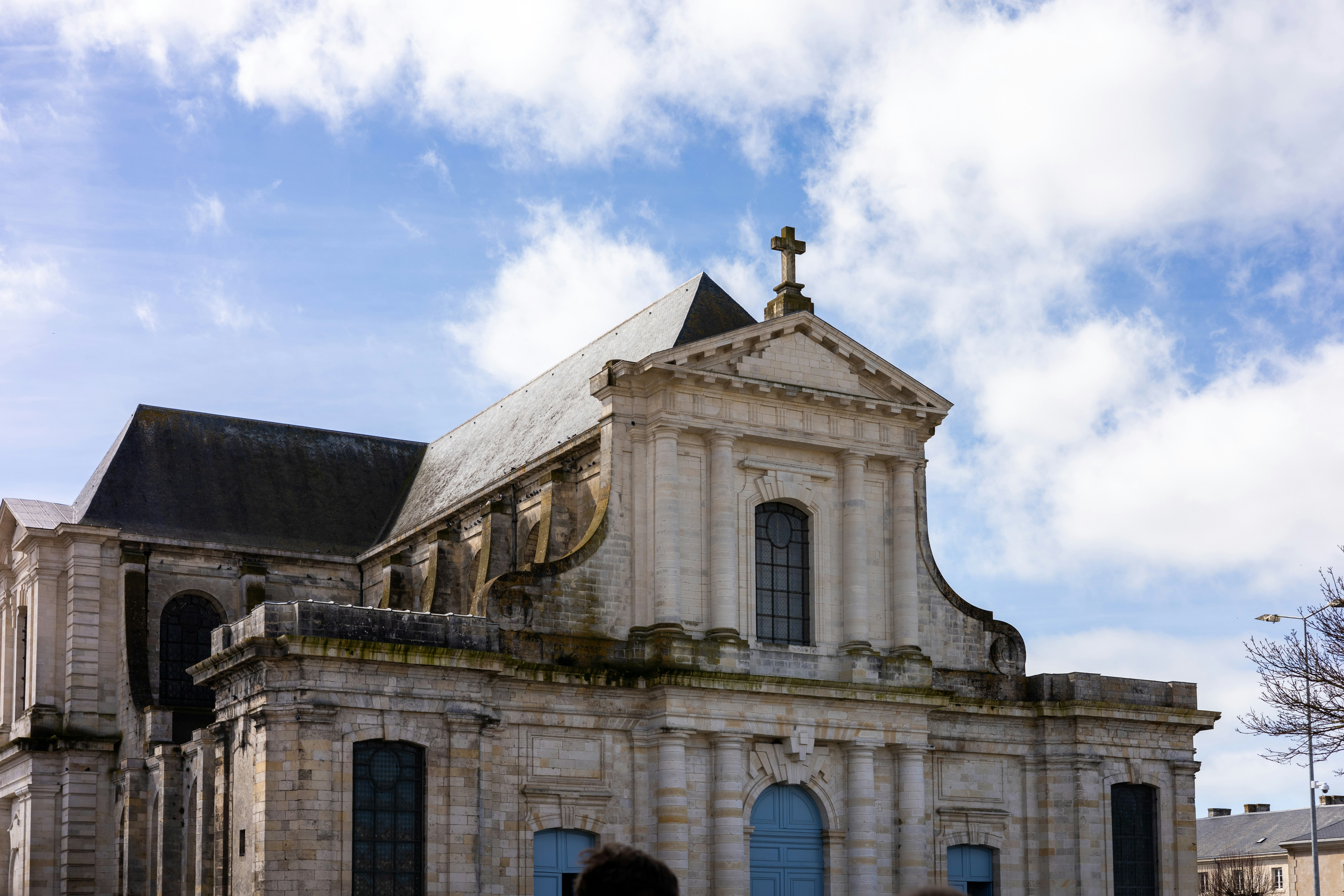 a large building with a cross on top of it
