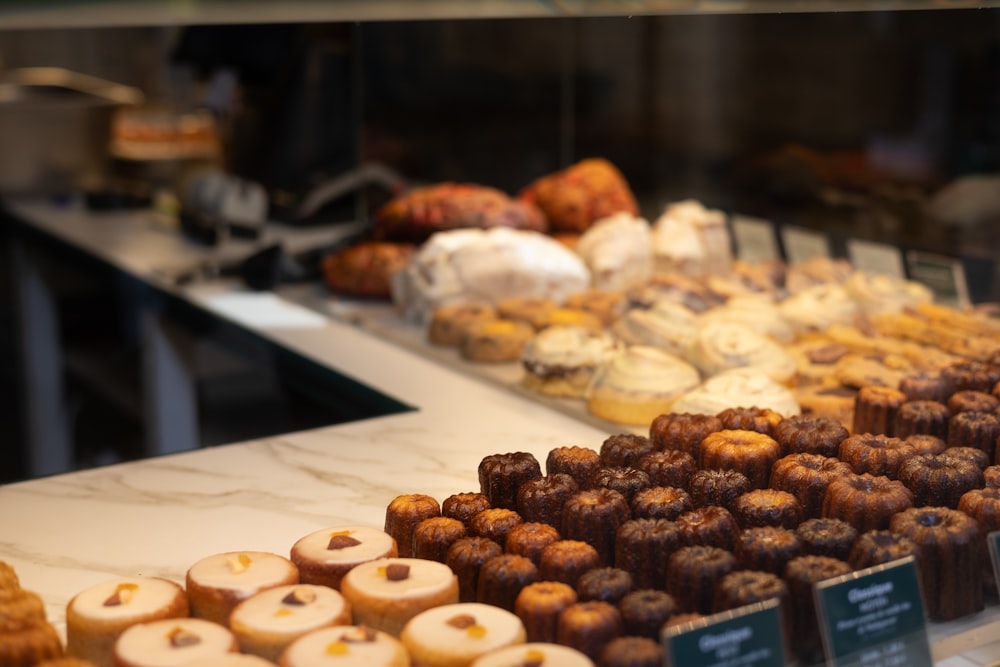 a display case filled with lots of different types of pastries