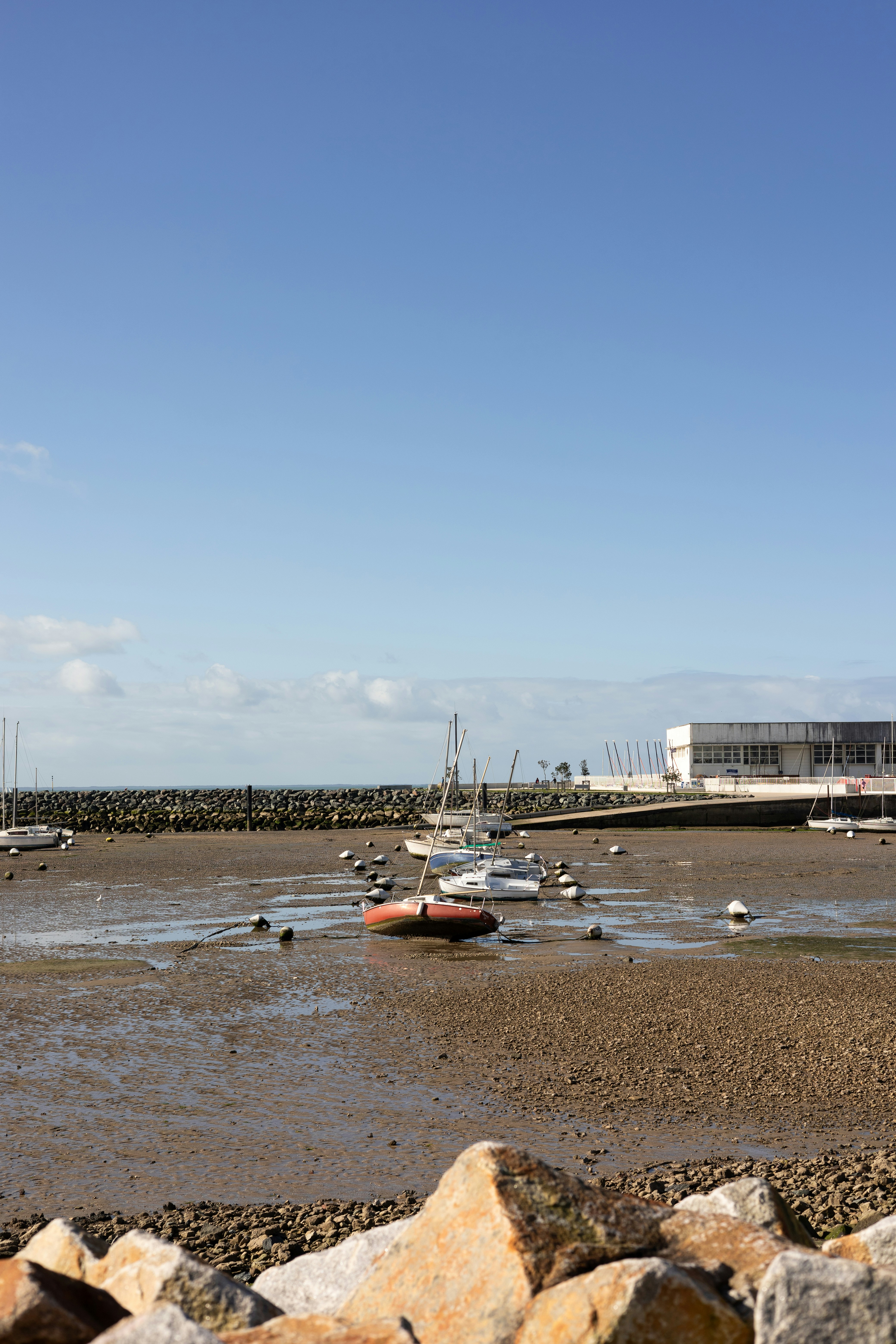 a group of boats floating on top of a body of water