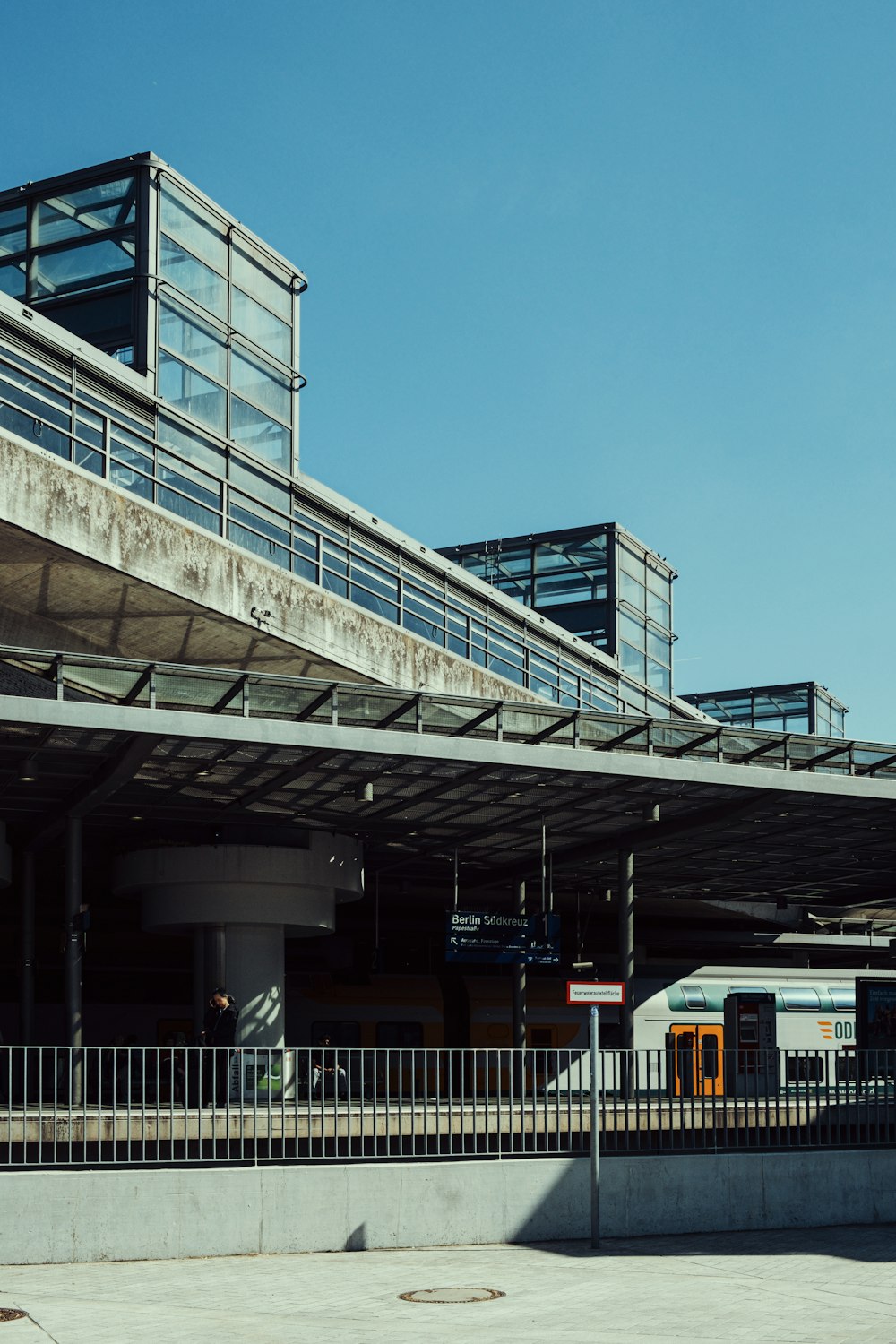 a train station with a train on the tracks