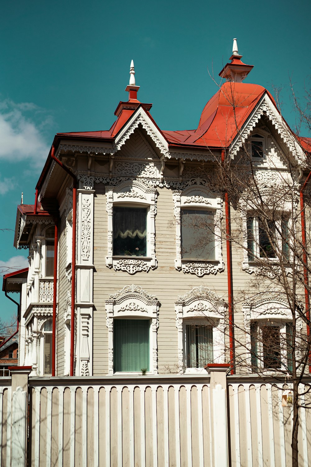 a large white house with a red roof