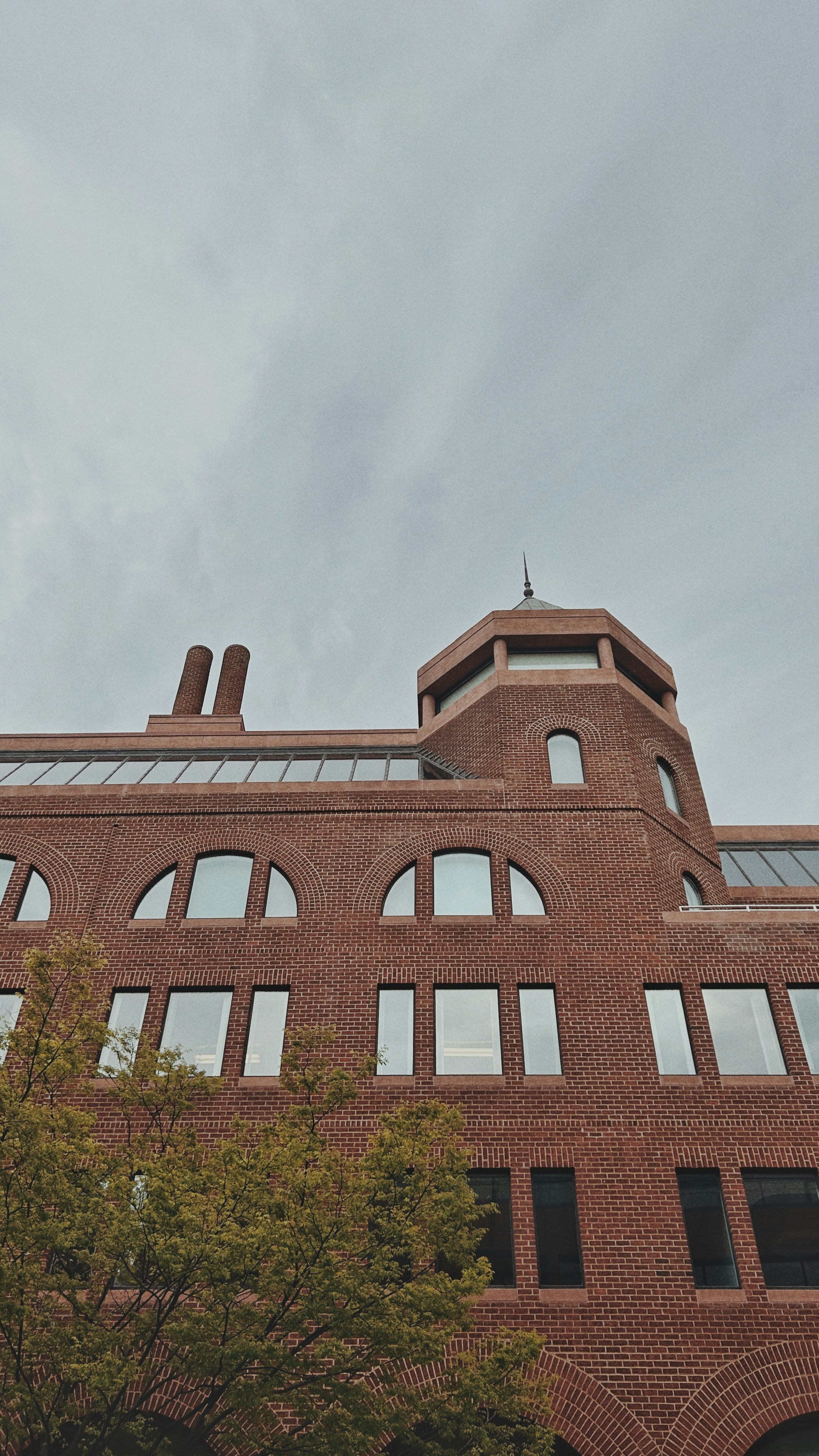 a clock on the side of a brick building