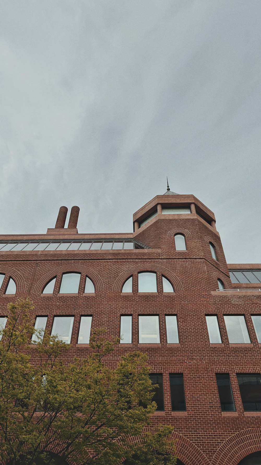 a clock on the side of a brick building