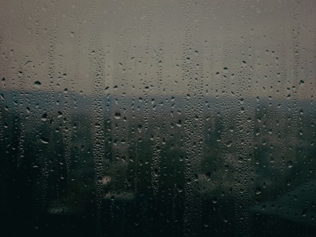 a window with rain drops on it