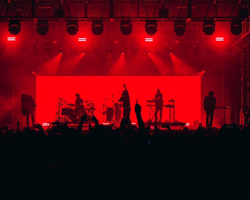 a group of people standing on top of a stage