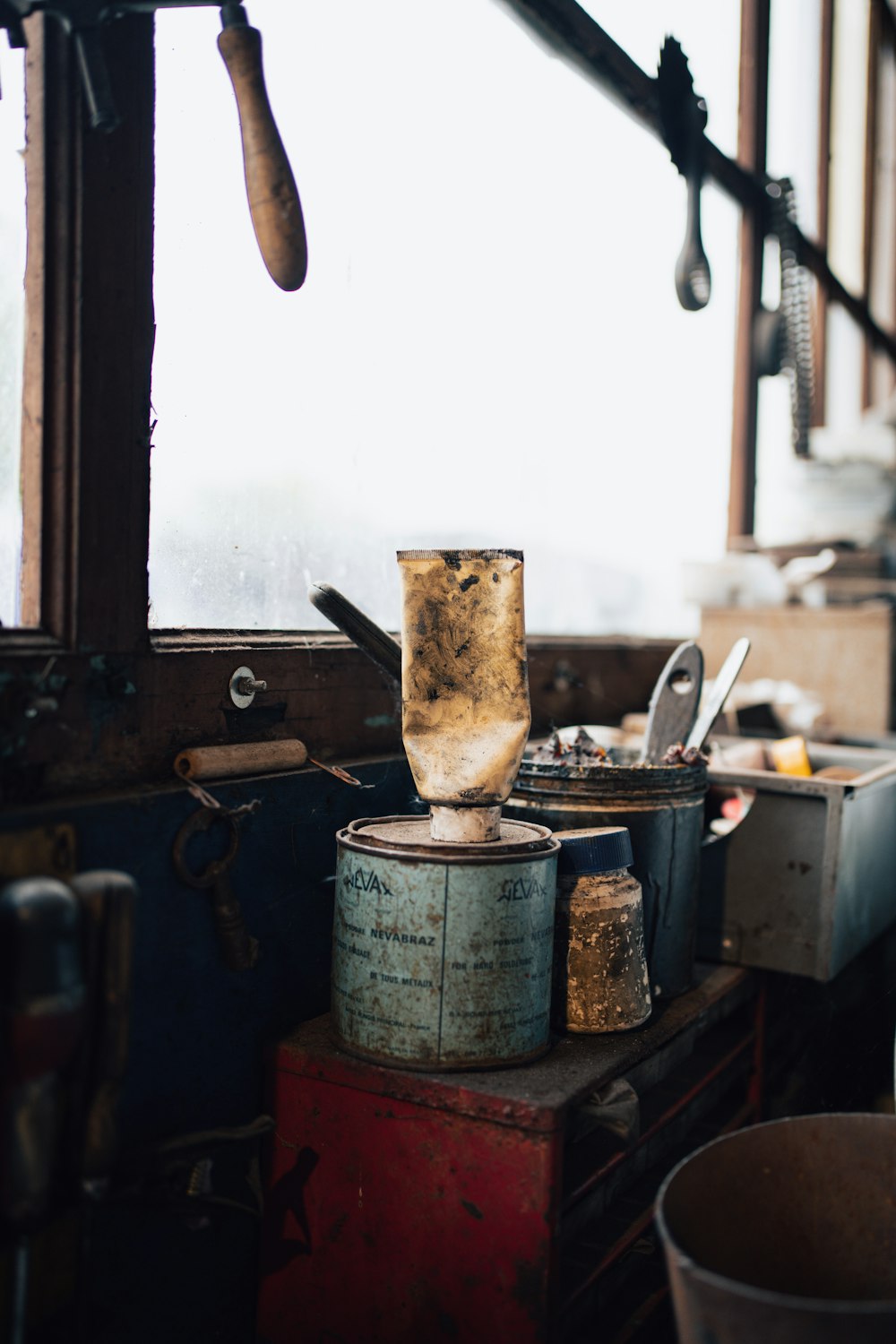 an old kitchen with a stove and pots on the counter