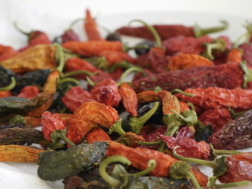 a pile of dried red and green peppers