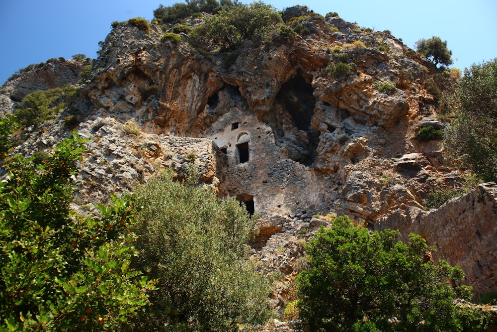 a rock formation with a cave in the middle of it