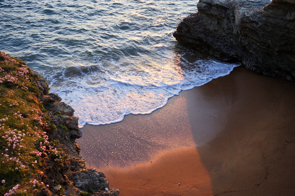 a beach with waves coming in to the shore