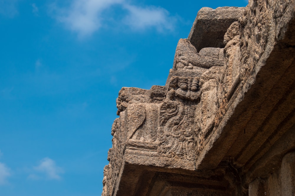 a close up of a stone carving on a building