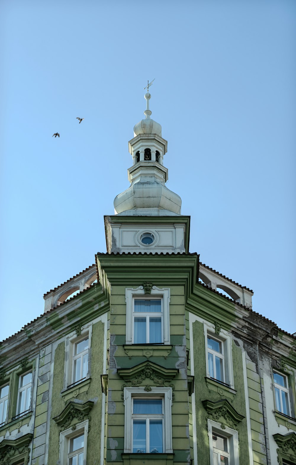 a tall building with a clock on the top of it