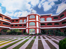 a red and white building with a clock tower