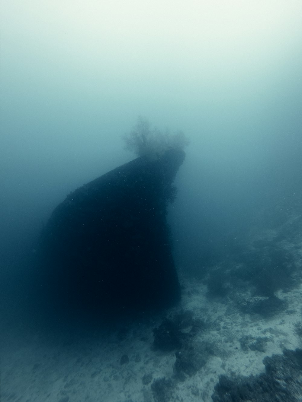 a large boat is submerged in the water