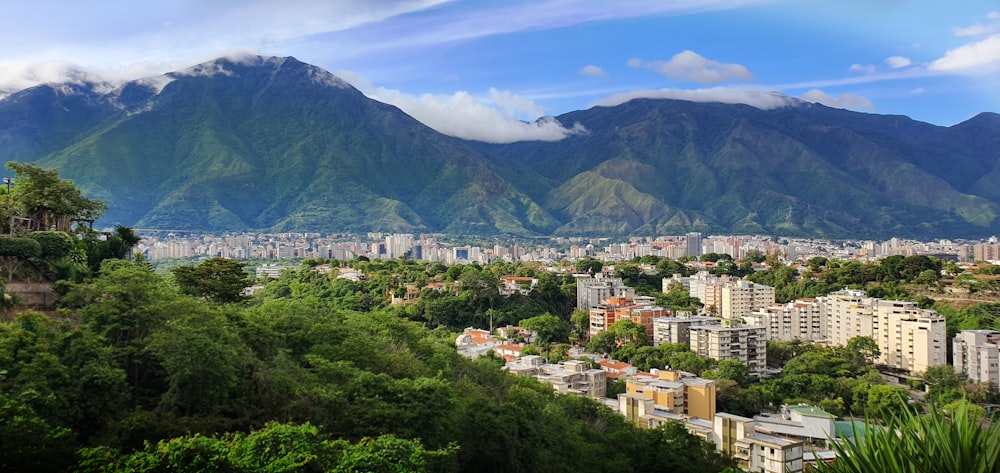 a view of a city with mountains in the background