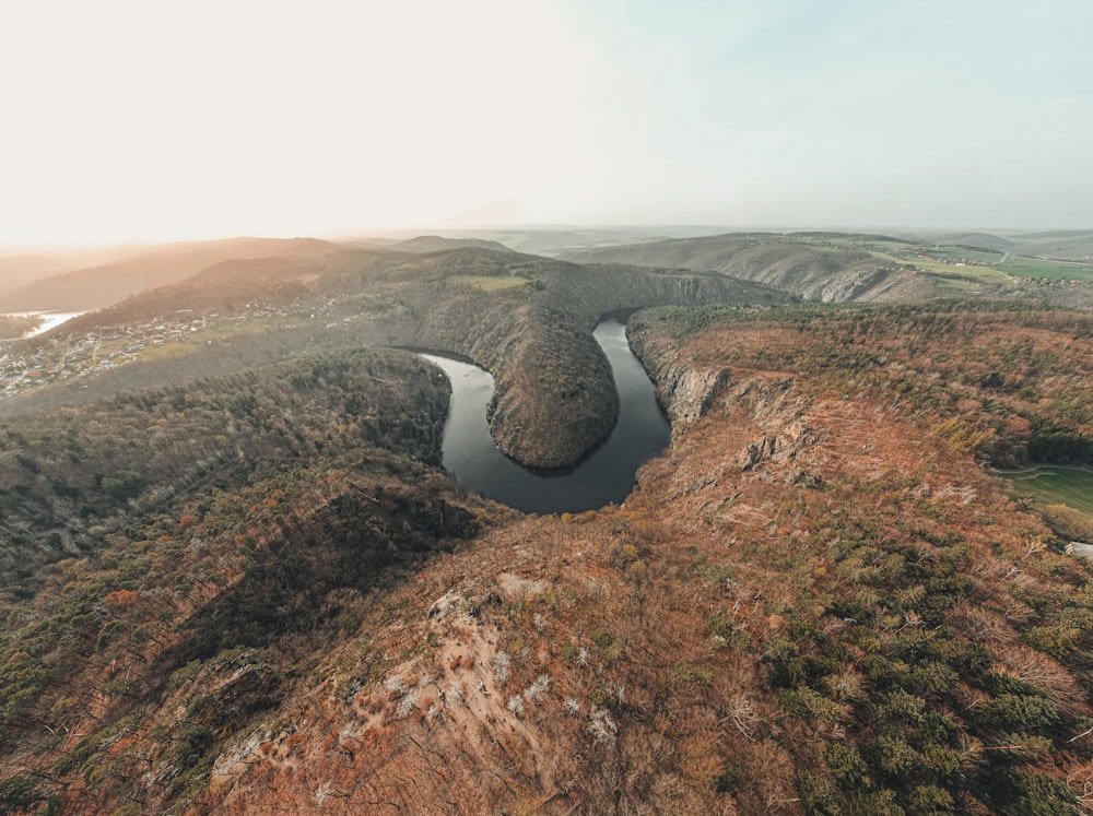 an aerial view of a river running through a valley