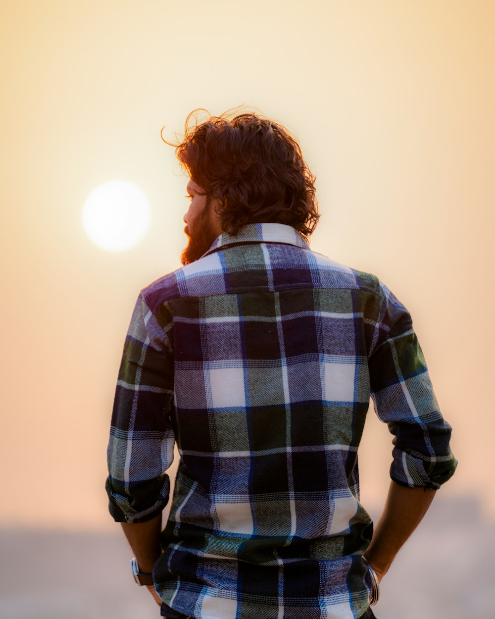 a man standing with his hands on his hips