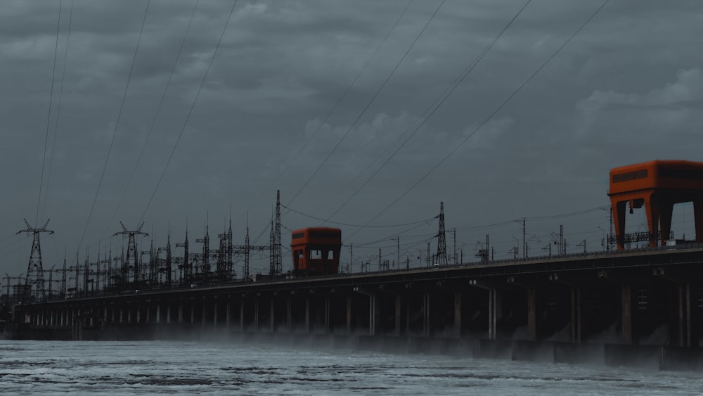 a large body of water with power lines above it
