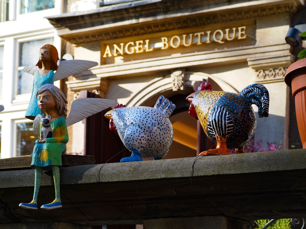 a group of figurines sitting on top of a building