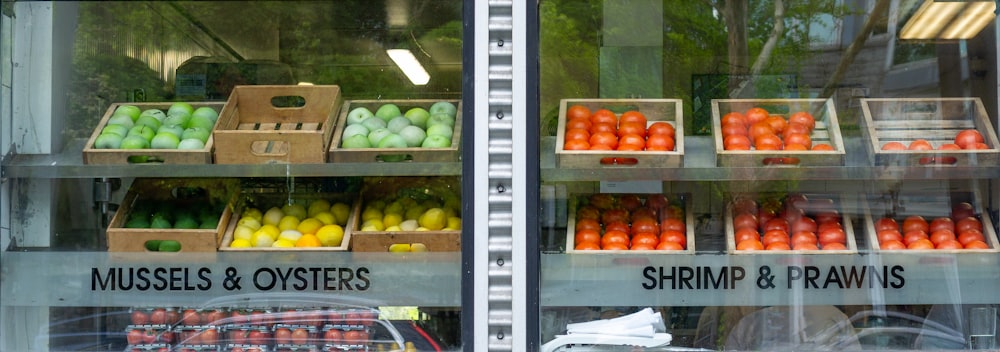a store window with a display of fruits and vegetables