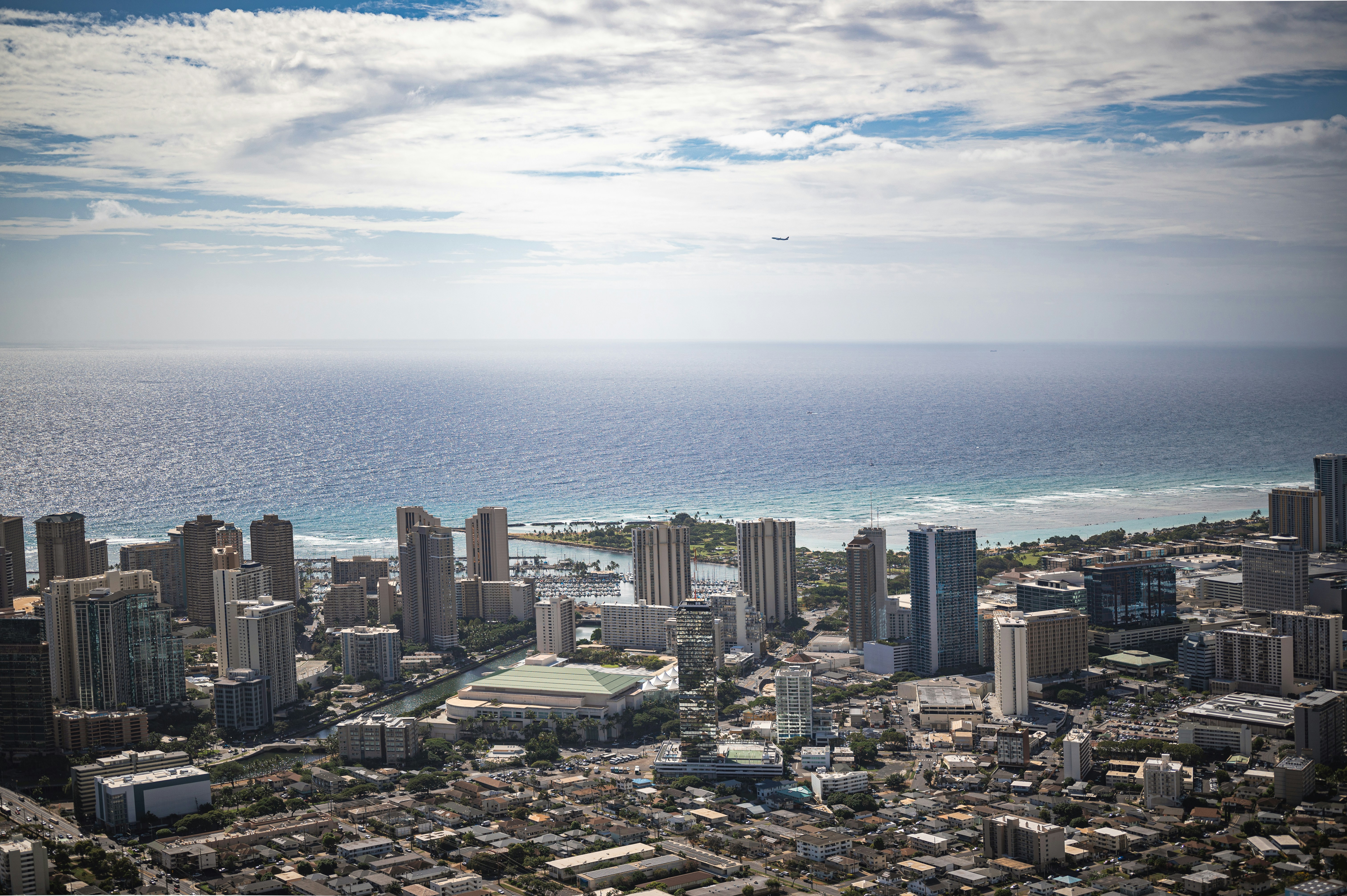 an aerial view of a city and the ocean