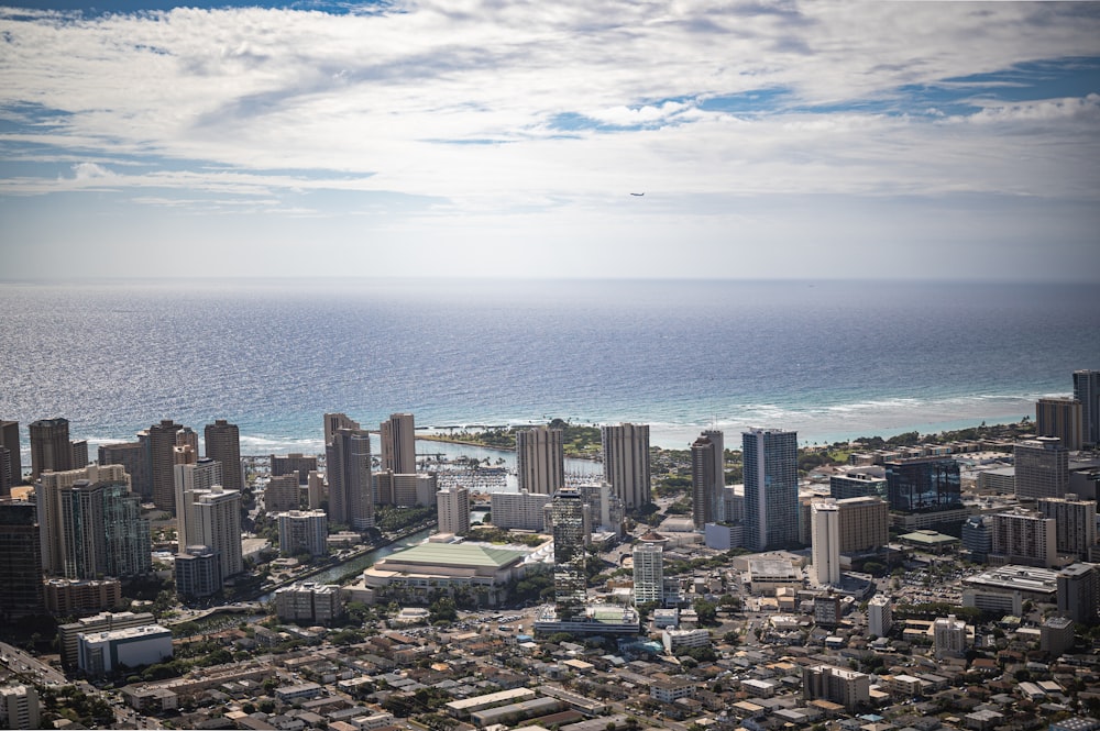 an aerial view of a city and the ocean