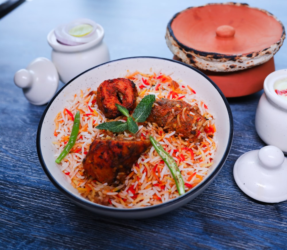 a plate of food with rice and meat