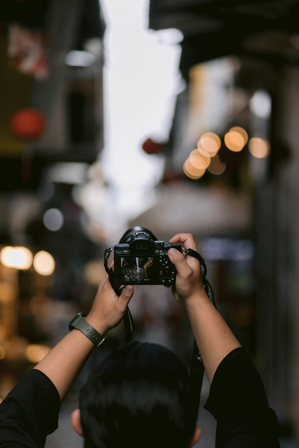 a person holding a camera up to take a picture