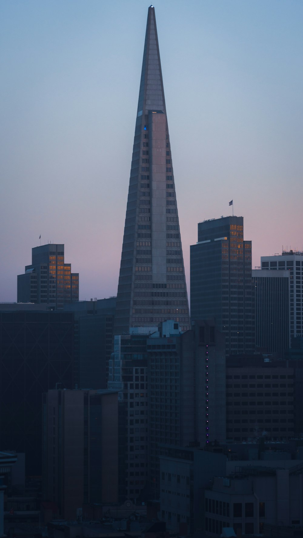 a very tall building towering over a city