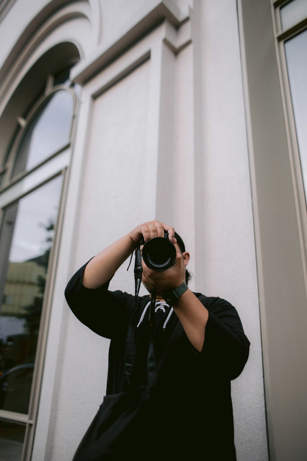 a person taking a picture with a camera