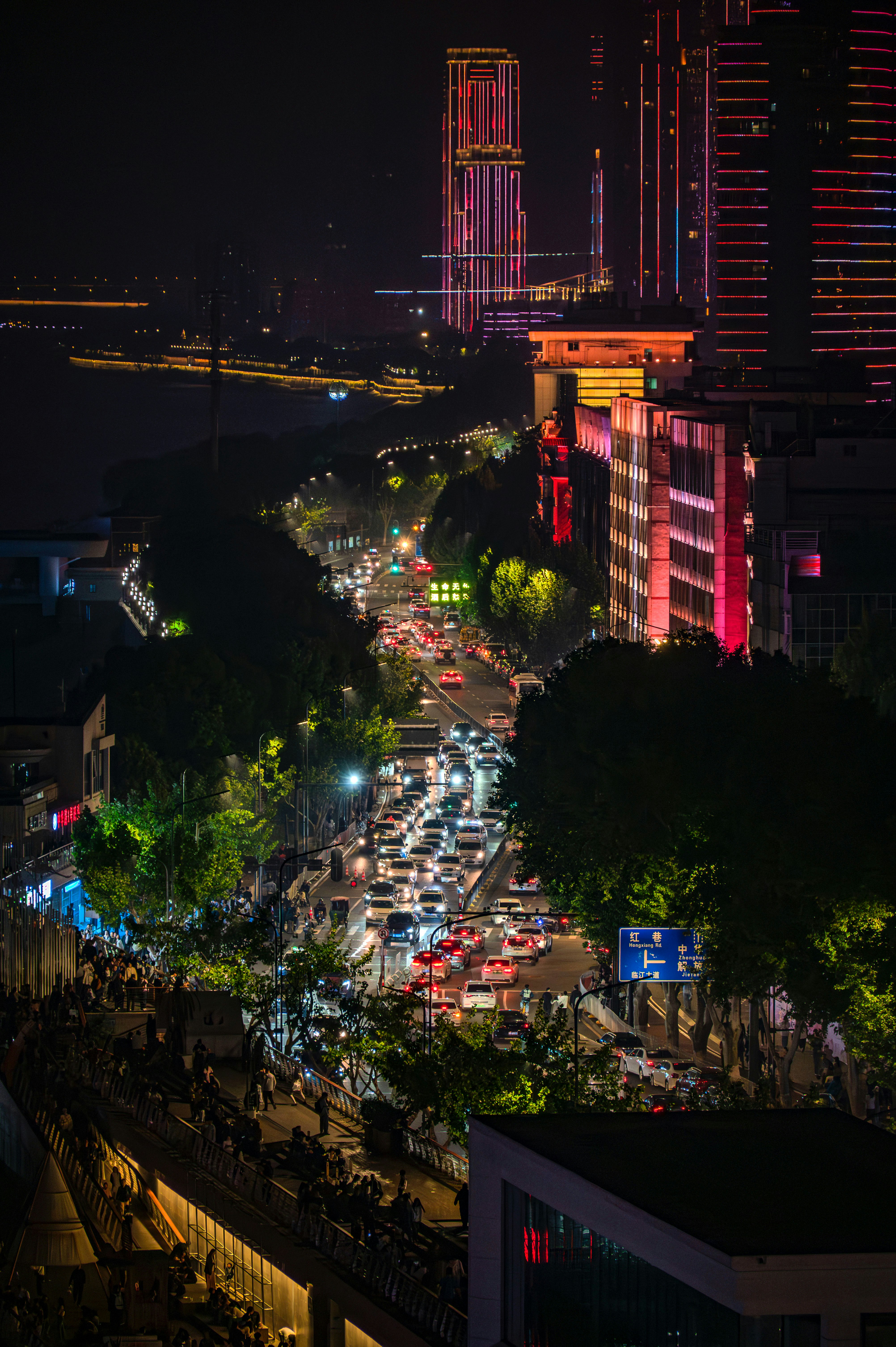 A city street filled with lots of traffic at night photo – Free Urban ...
