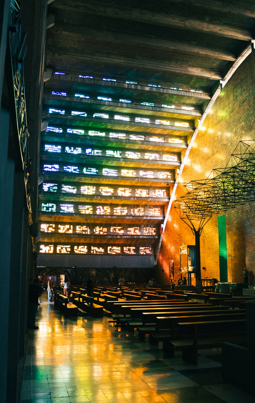 the inside of a church with a lot of benches