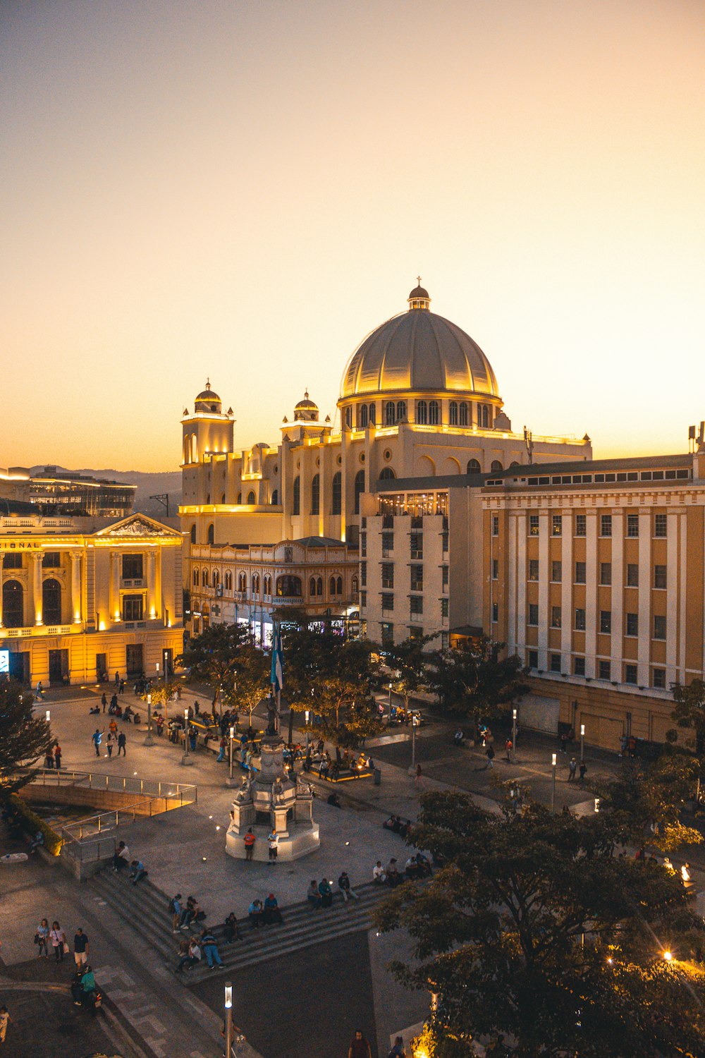 a large building with a lot of people around it