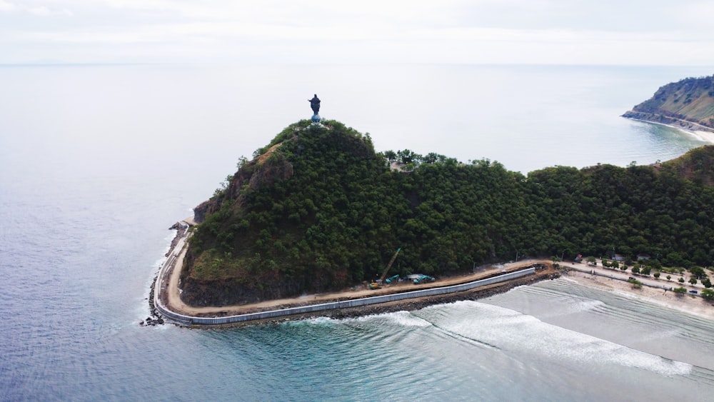 a person standing on top of a small island