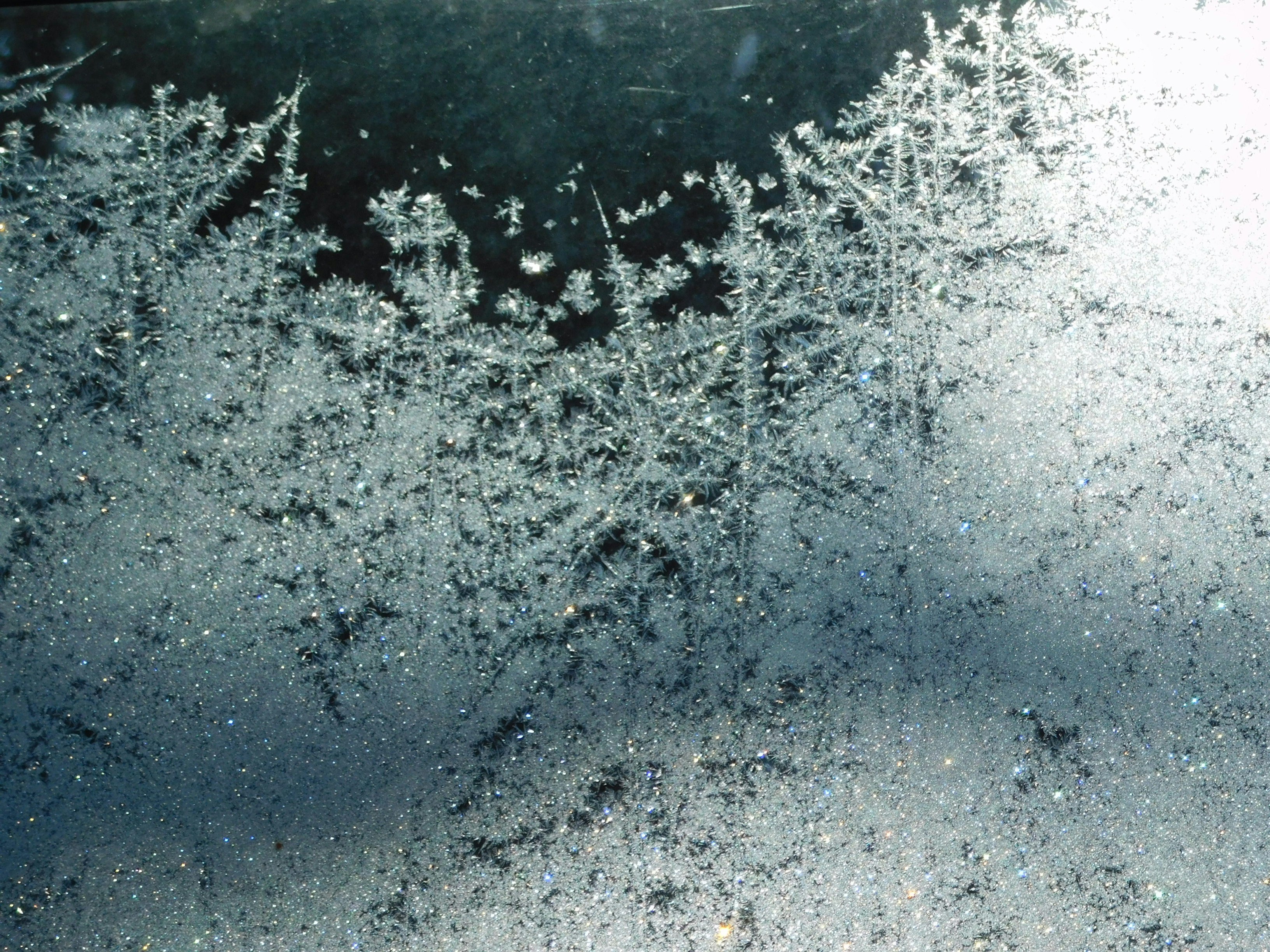 a close up of a frosty window on a car