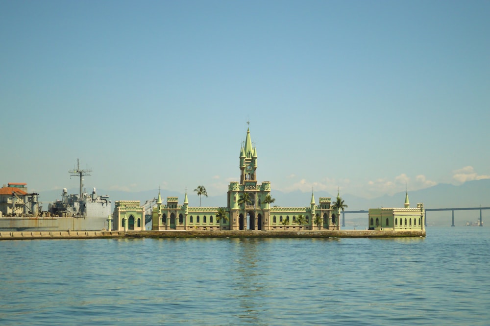 a large building sitting on top of a body of water