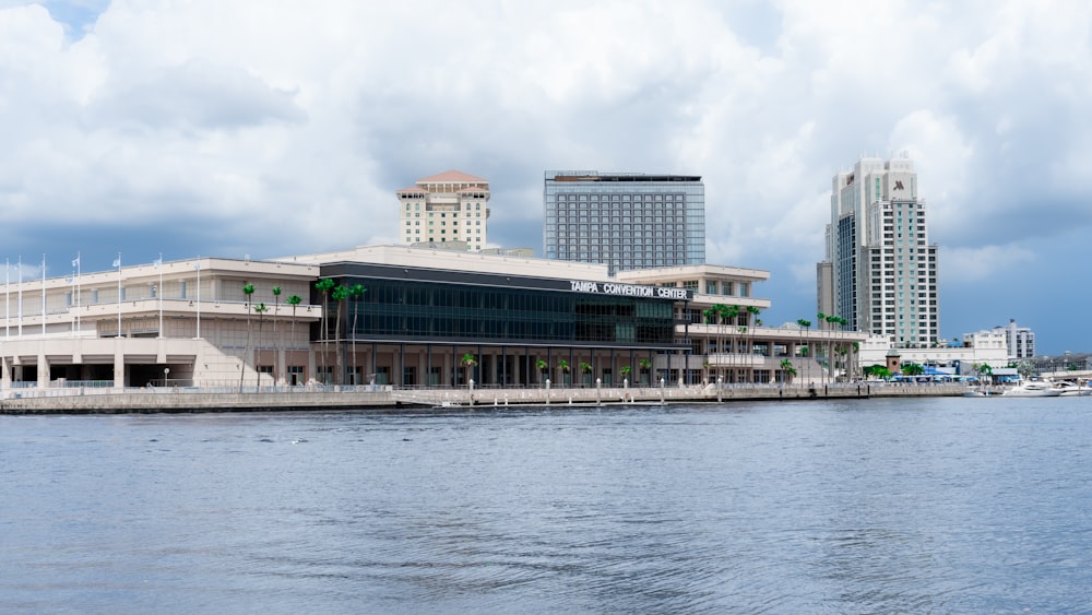 a large building sitting on the side of a body of water
