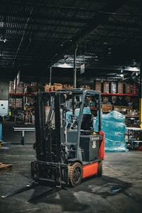 a forklift parked inside of a warehouse