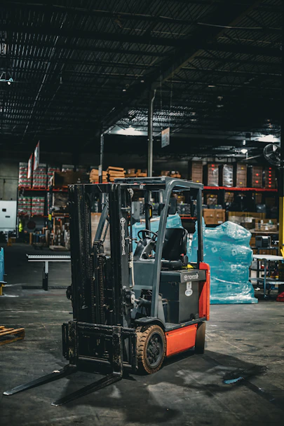 a forklift parked inside of a warehouse