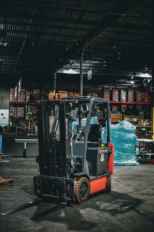 a forklift parked inside of a warehouse