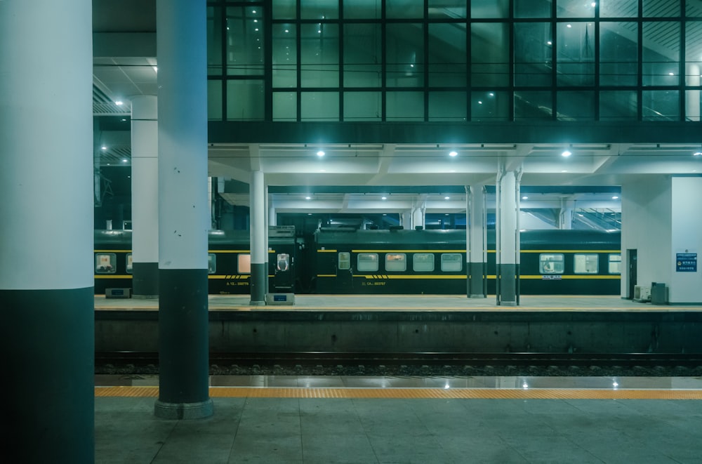 a train station with a train on the tracks