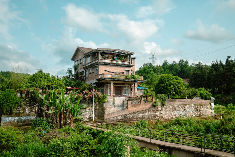 a house on a hill surrounded by trees